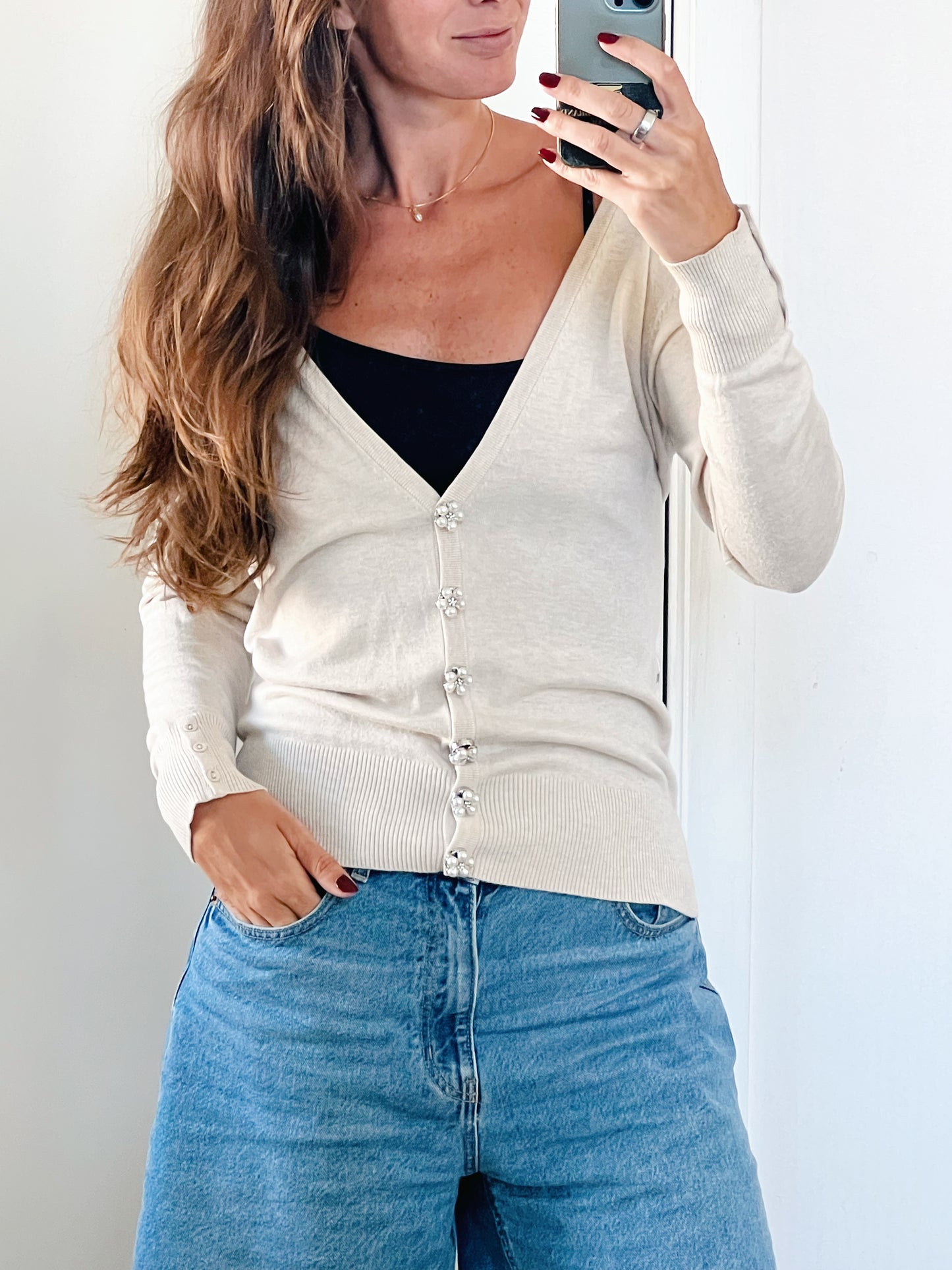 Rosi Button Cover on a beige cardigan