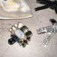 Shoe Charm Pin Silver The Shoelace Brand on a shoeclip